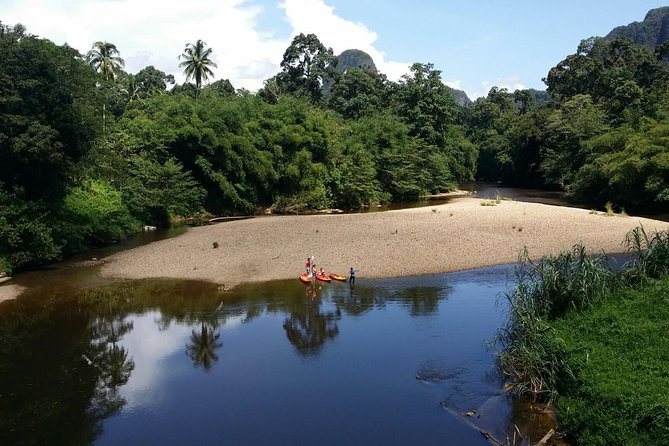 3-in-1 Ultimate Borneo Expedition Adventure - Kayaking toward waterfalls and limestone