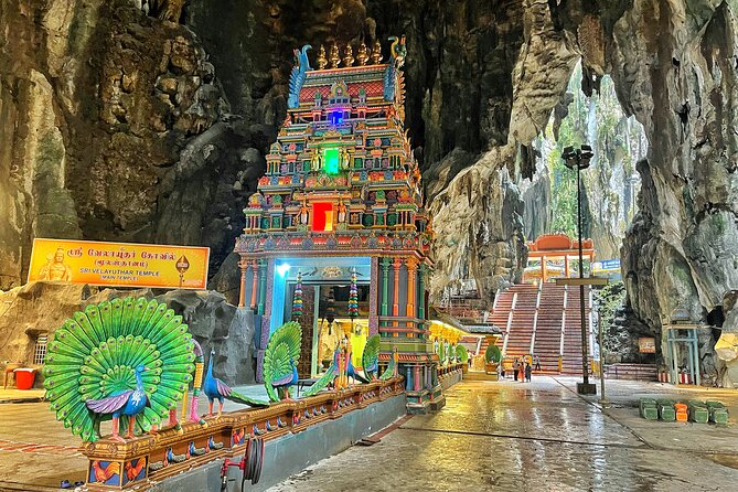 Batu Caves Twilight and Little India Evening Tour - The glowing displays inside Ramayana Cave