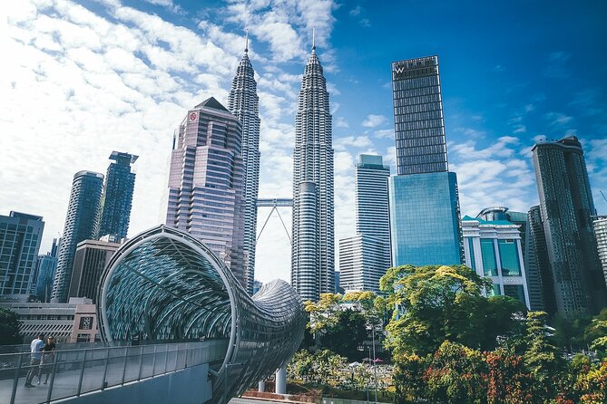 Kuala Lumpur Airport Transit Tour - The Twin Towers and KL Tower show modern Kuala Lumpur